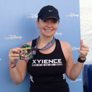 Jennifer Turchin showing marathon medal